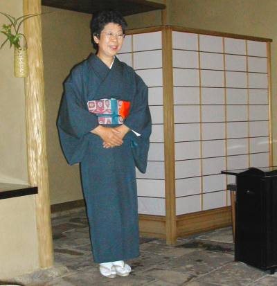 Look at the beautiful kimono (a traditional Japanese dress). Look at the beautiful kimono (a traditional Japanese dress).